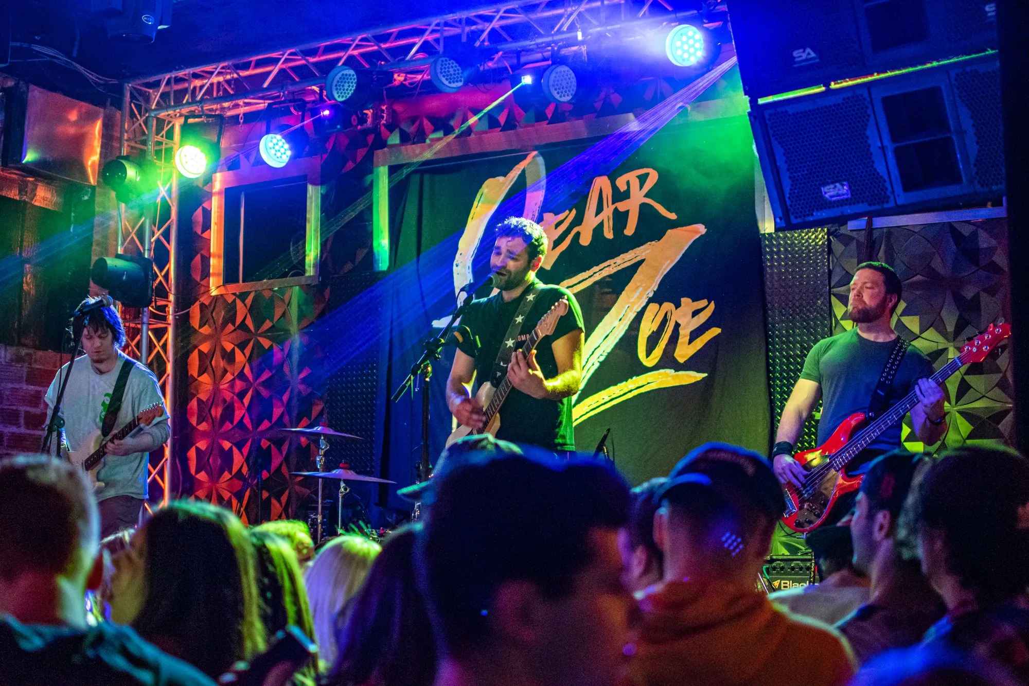 a group of people on stage playing instruments