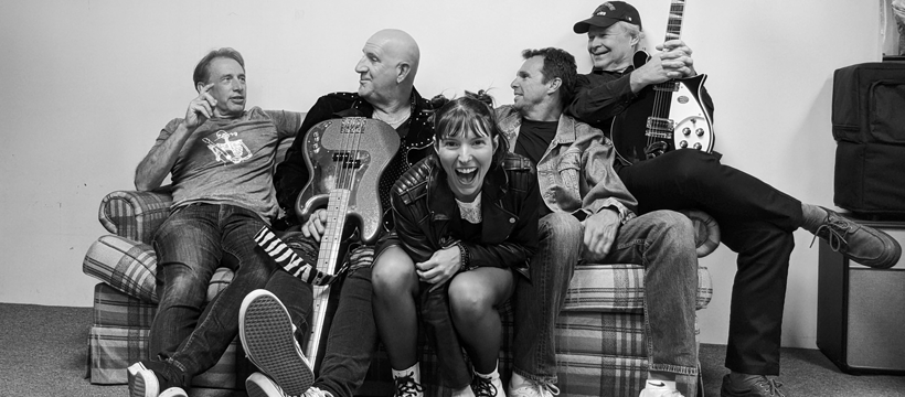 a group of people sitting on top of a couch